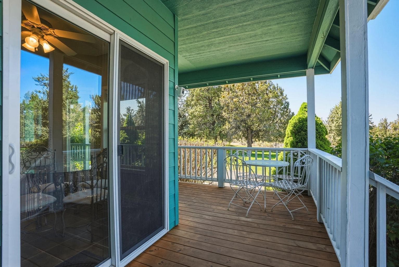 Sliding glass door off kitchen with covered deck