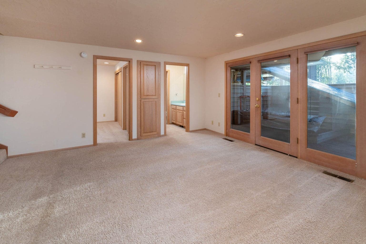Your second living room area with French door access to the decks to the 2nd & 3rd Junior ensuites have another place to gather with easy access to the lower deck/backyard & hot tub!