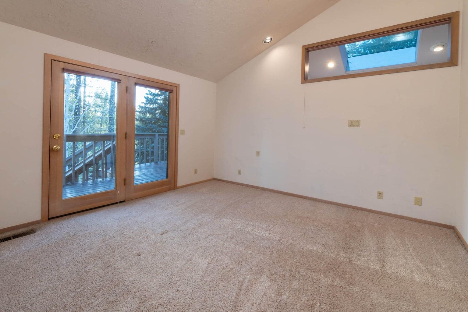 The 1st primary/ensuite upstairs w/private, French doors to the upper deck.