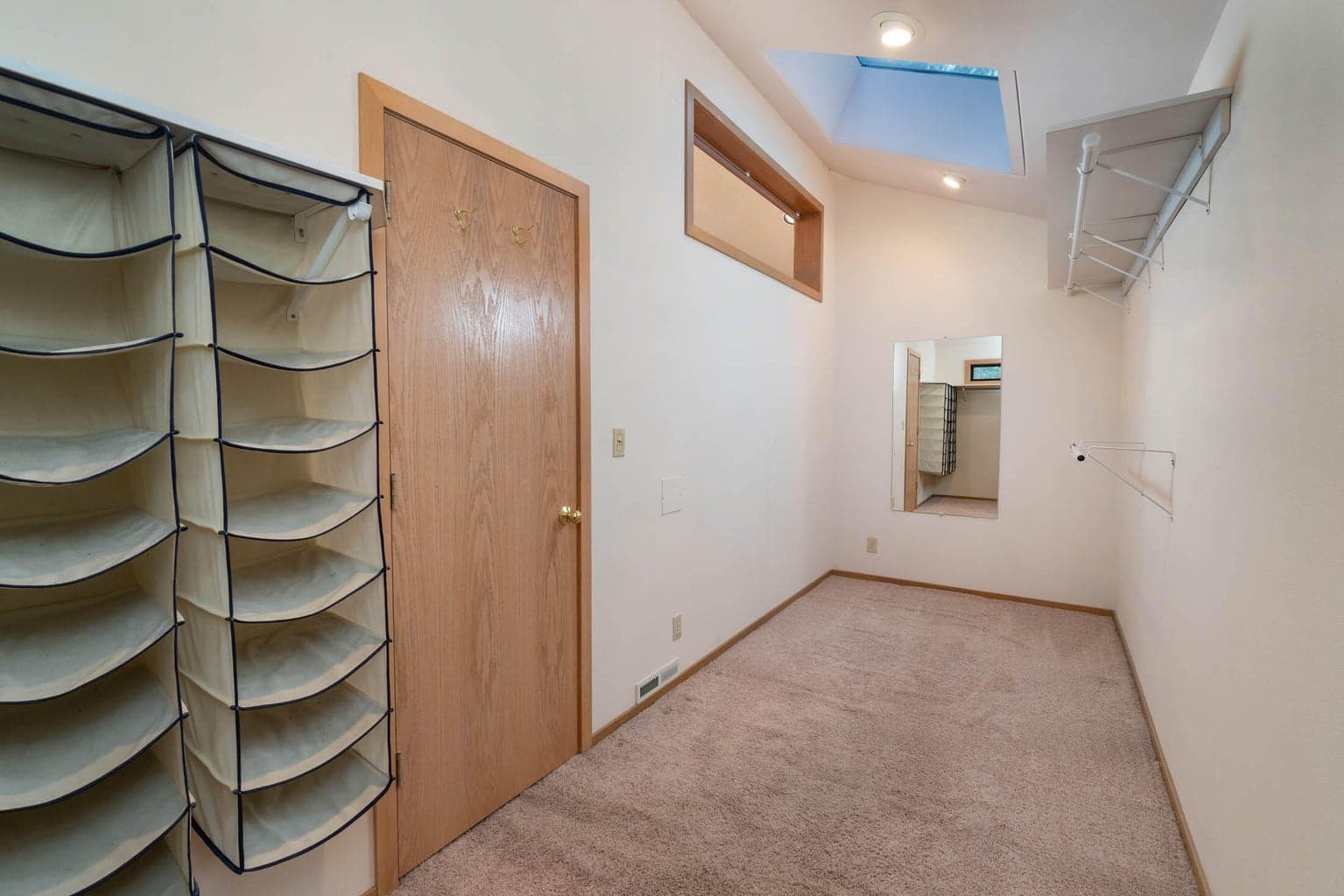 One of the two walk-in closets. This could be your dressing room or boudoir! Complete w/laundry chute to the laundry room downstairs! The back end abuttes to an outdoor closet. So, that storage space could become a sauna if desired!