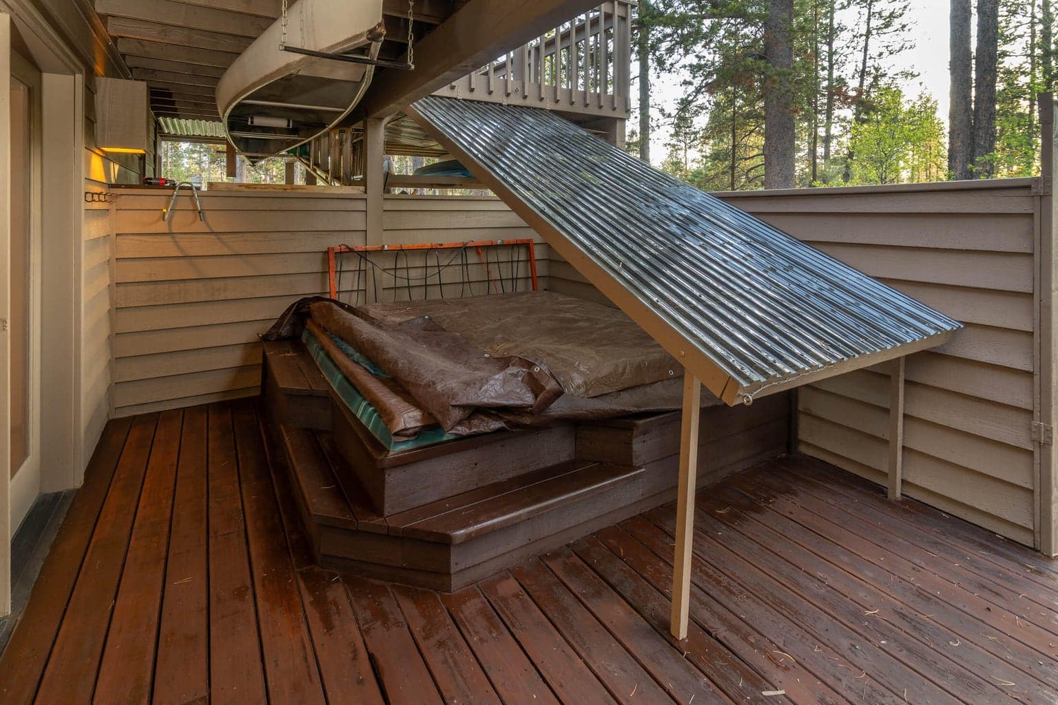 Hot tub is heated from the natural gas line. The clear snow shield can be easily removed when you wish. Privacy wall & easy access to lower guest quarters and to the back yard and all your recreational toys! The garden, trash & tool storage has its own separate storage areas around the lower level.