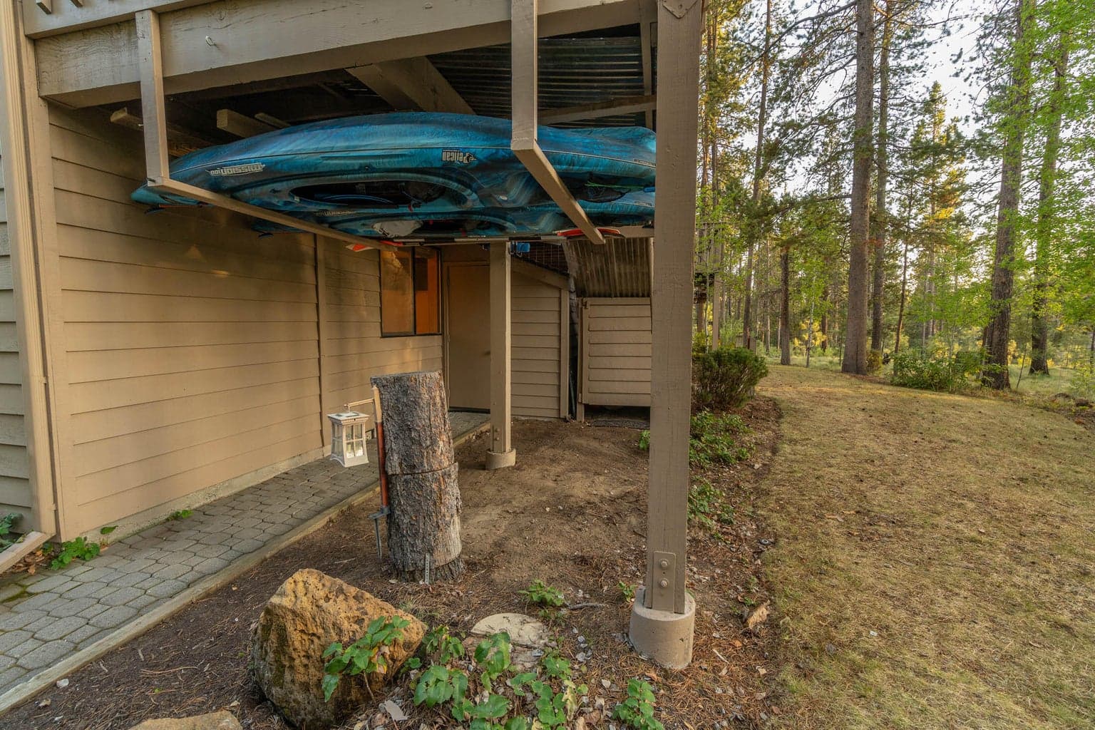 Paved trash walkway and area, separate/enclosed tool room and garden maintenance area neatly store their related items.