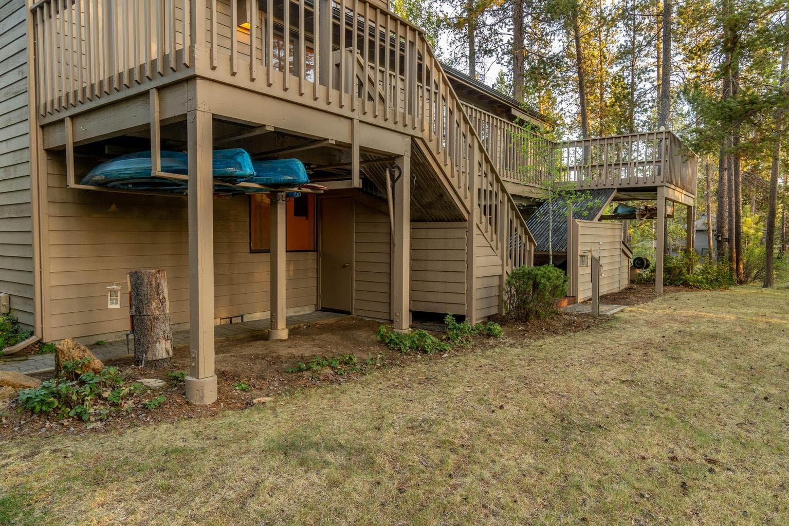Owners store up to 5 kayaks/canoes in this area on the backside of the house.