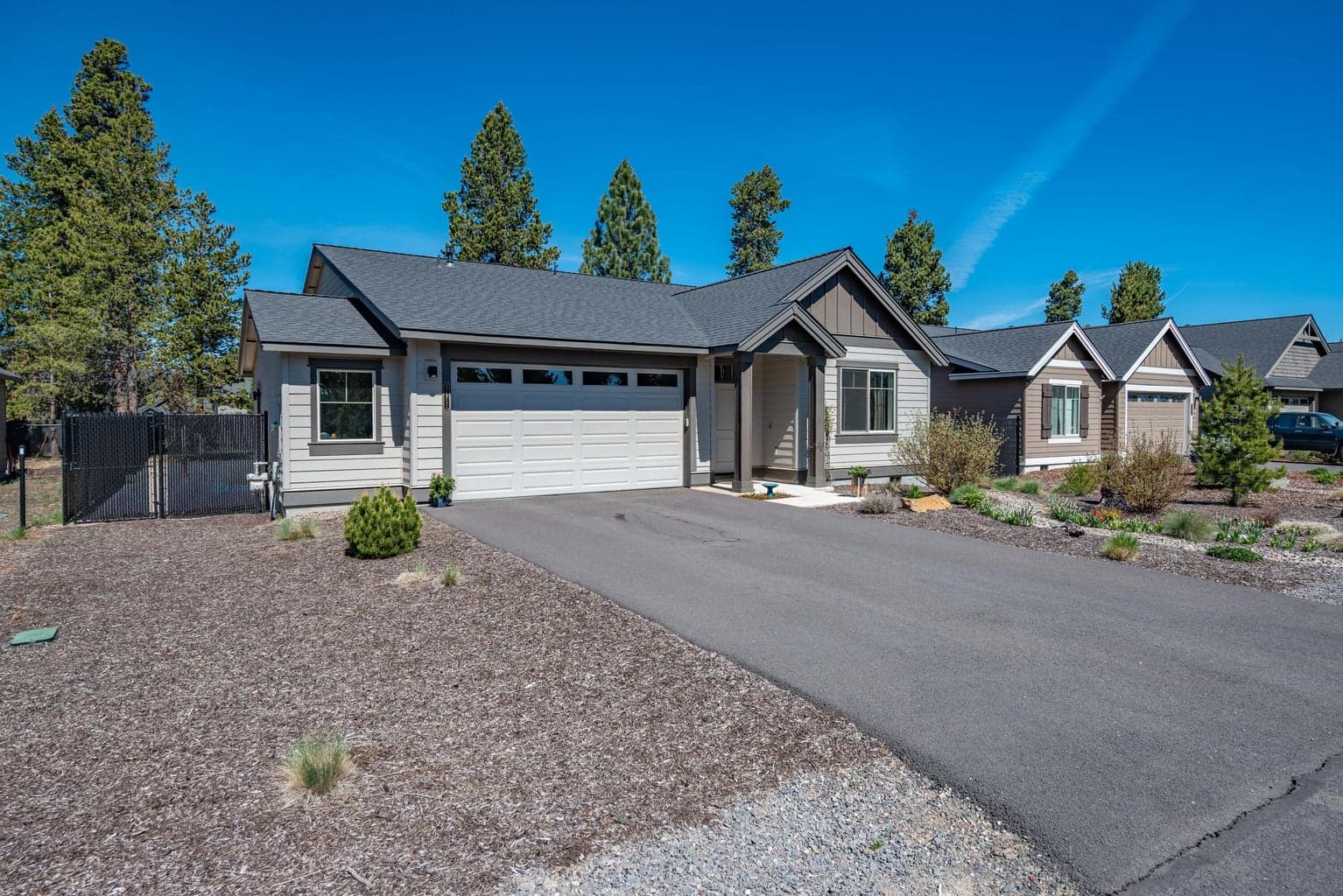 Ample driveway space with an oversized garage