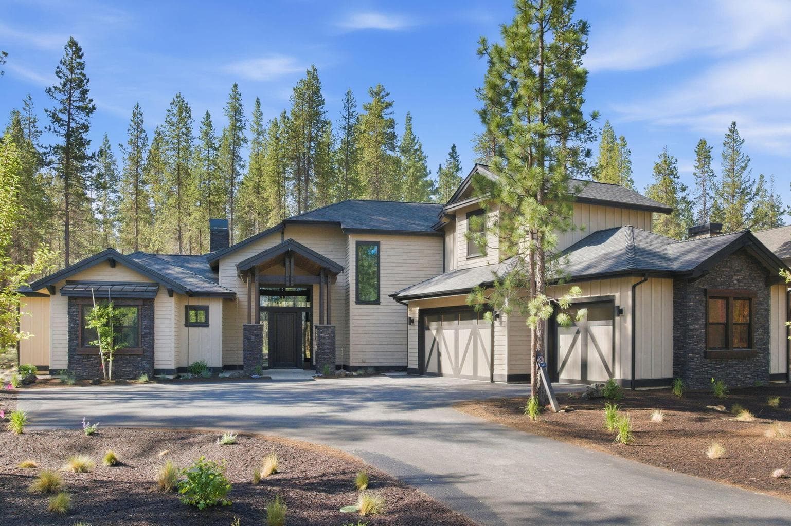 Three car garage, electric plug-in and third bay walled off for owner lock-off