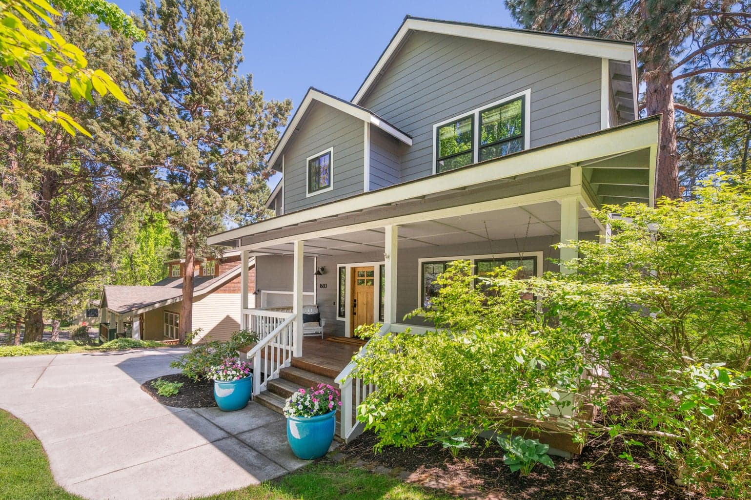 Timeless curb appeal with a classic, welcoming covered front porch.