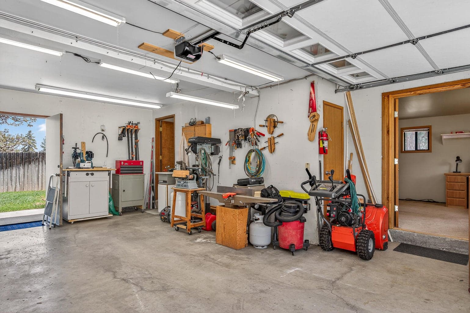The door to the right of the exterior door leads to a room above the garage that makes a nice quiet office or extra sleeping area or whatever you decide you need