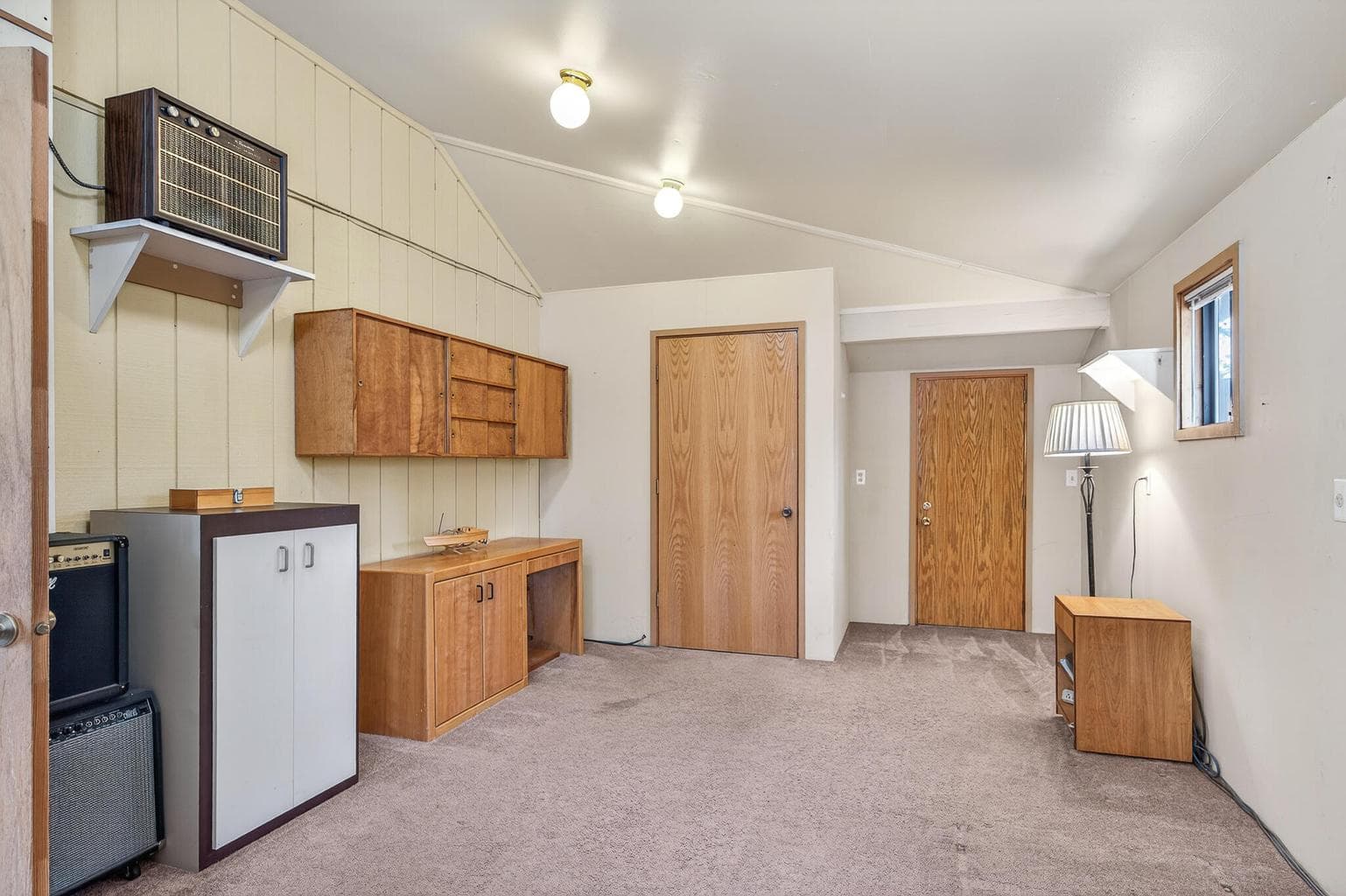 Same room. The door to the left is a closet an the door to the right accesses the back yard