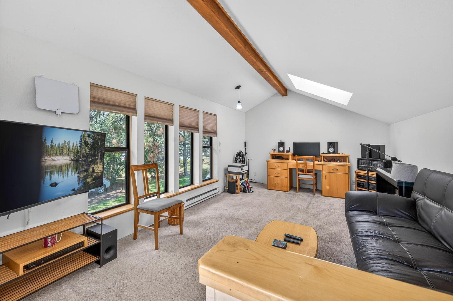 This room is a lovely vaulted room located over the garage. It was used as a music room, office, and TV room. It would be a extra sleeping space or you decide