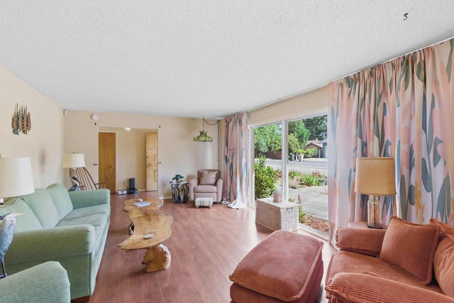 Tons of open natural light in living room and dining room combo.
