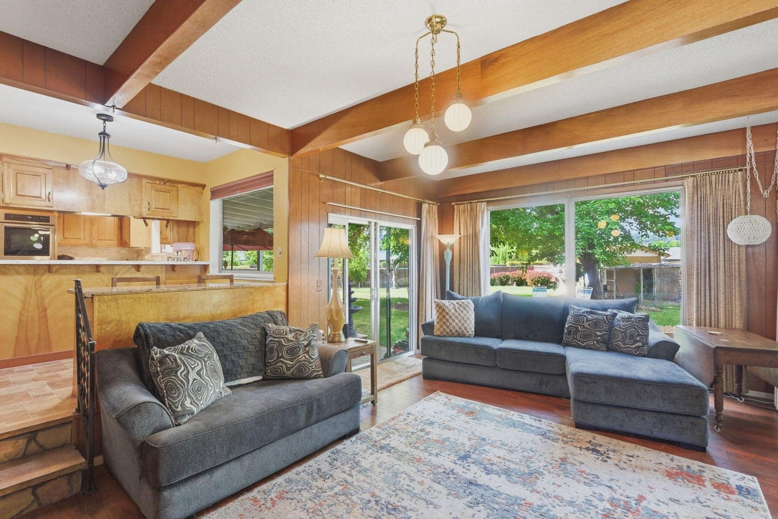 Second living area with windows that open to the back yard. Also Sliding glass doors that access the covered back patio and the enclosed back porch.