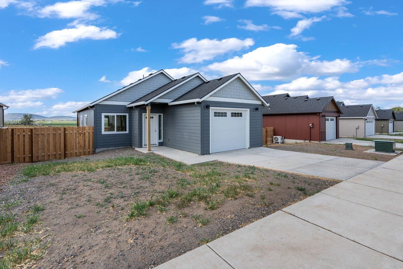 Welcome to this beautiful new construction home featuring modern design, a spacious driveway, and a two-car garage.