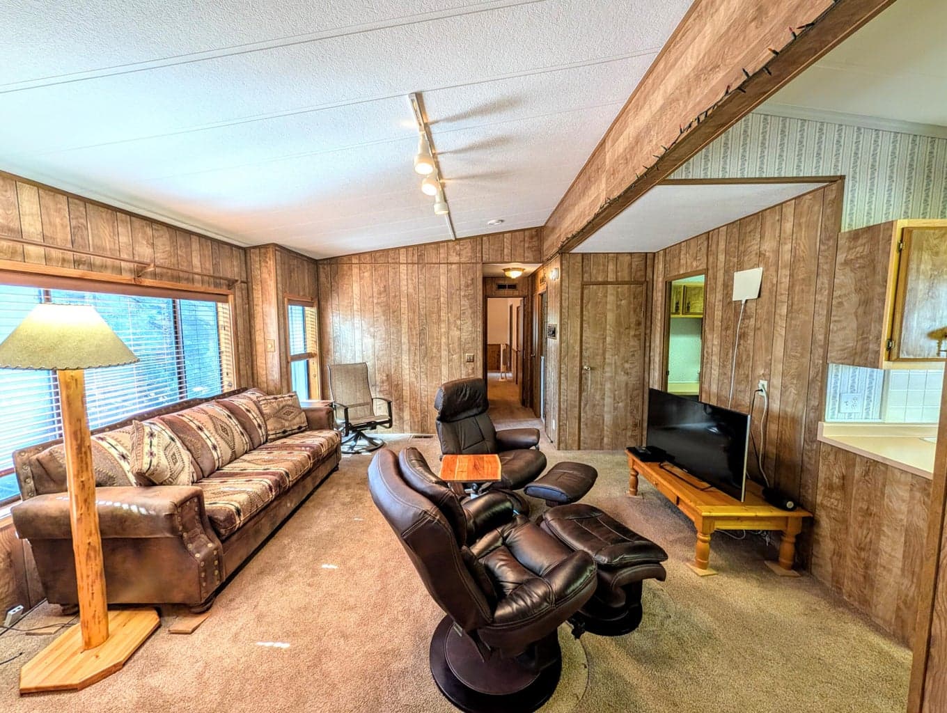 Several living areas including family room / den