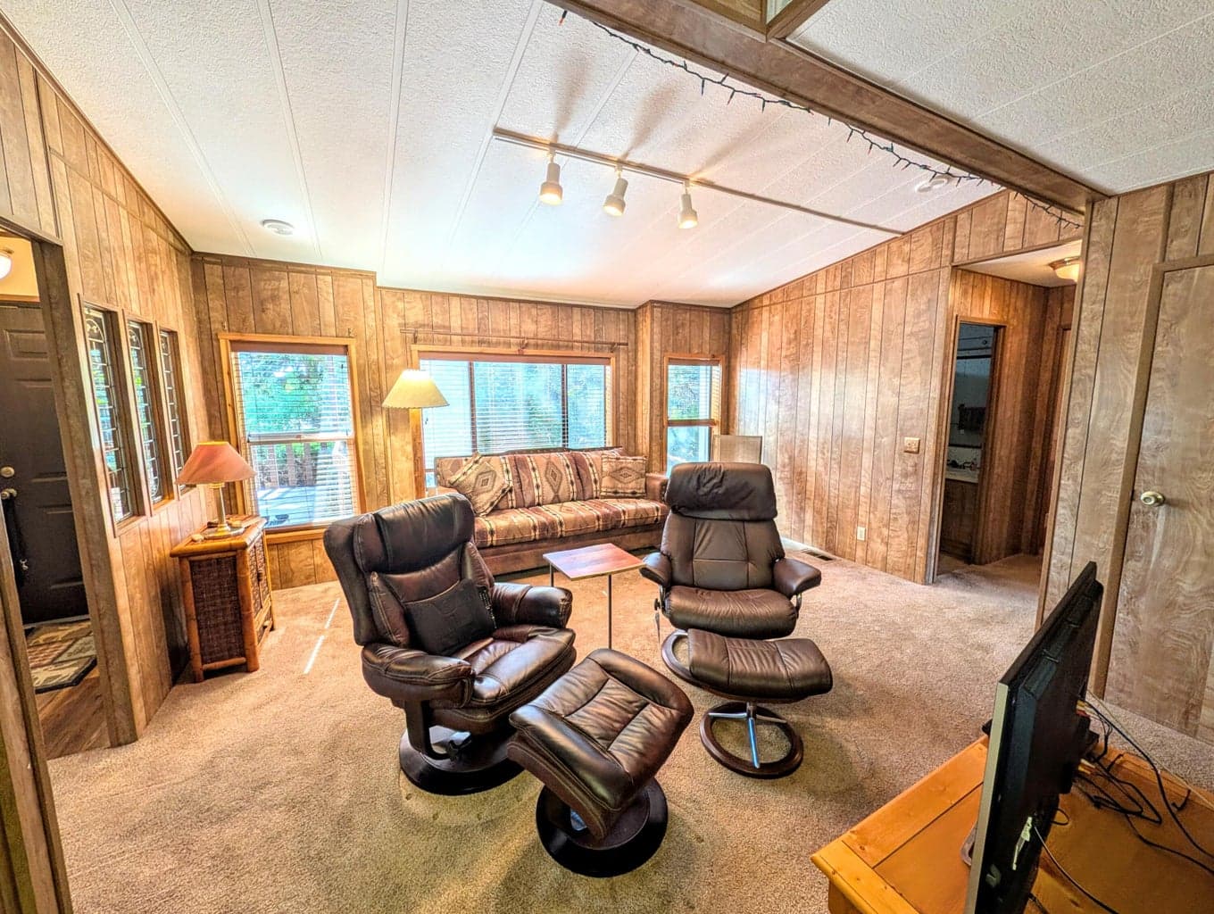 Several living areas including family room / den