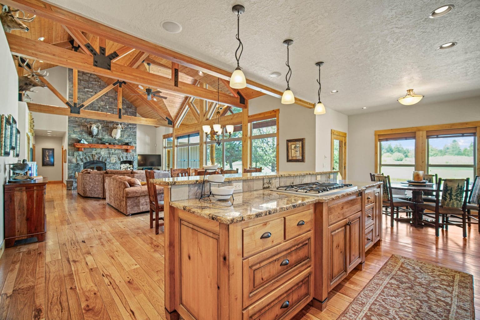 Kitchen opens to the great room, dining area, and breakfast nook, ideal for entertaining after days on the course or trails.
