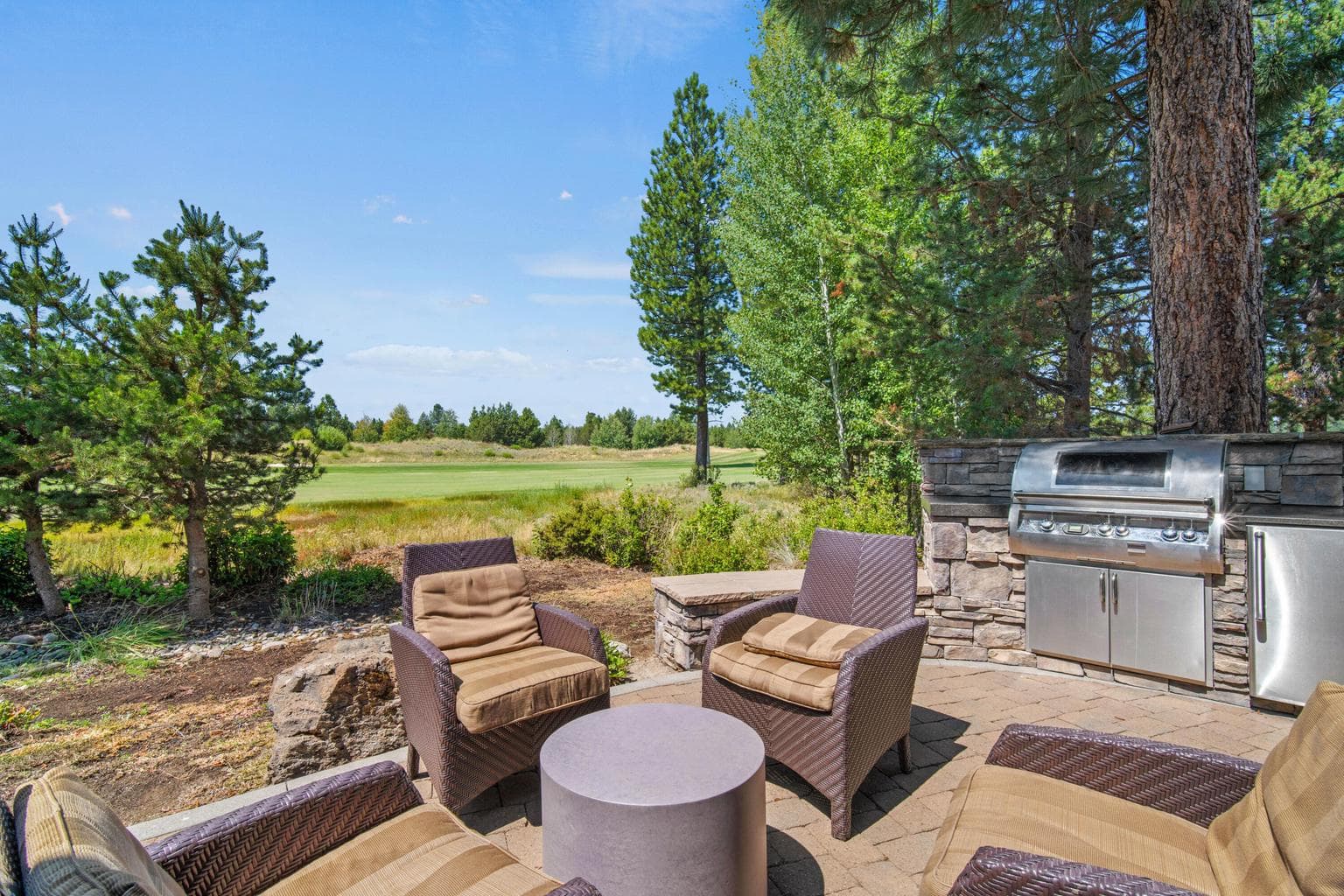 Additional outdoor living area with built-in BBQ.