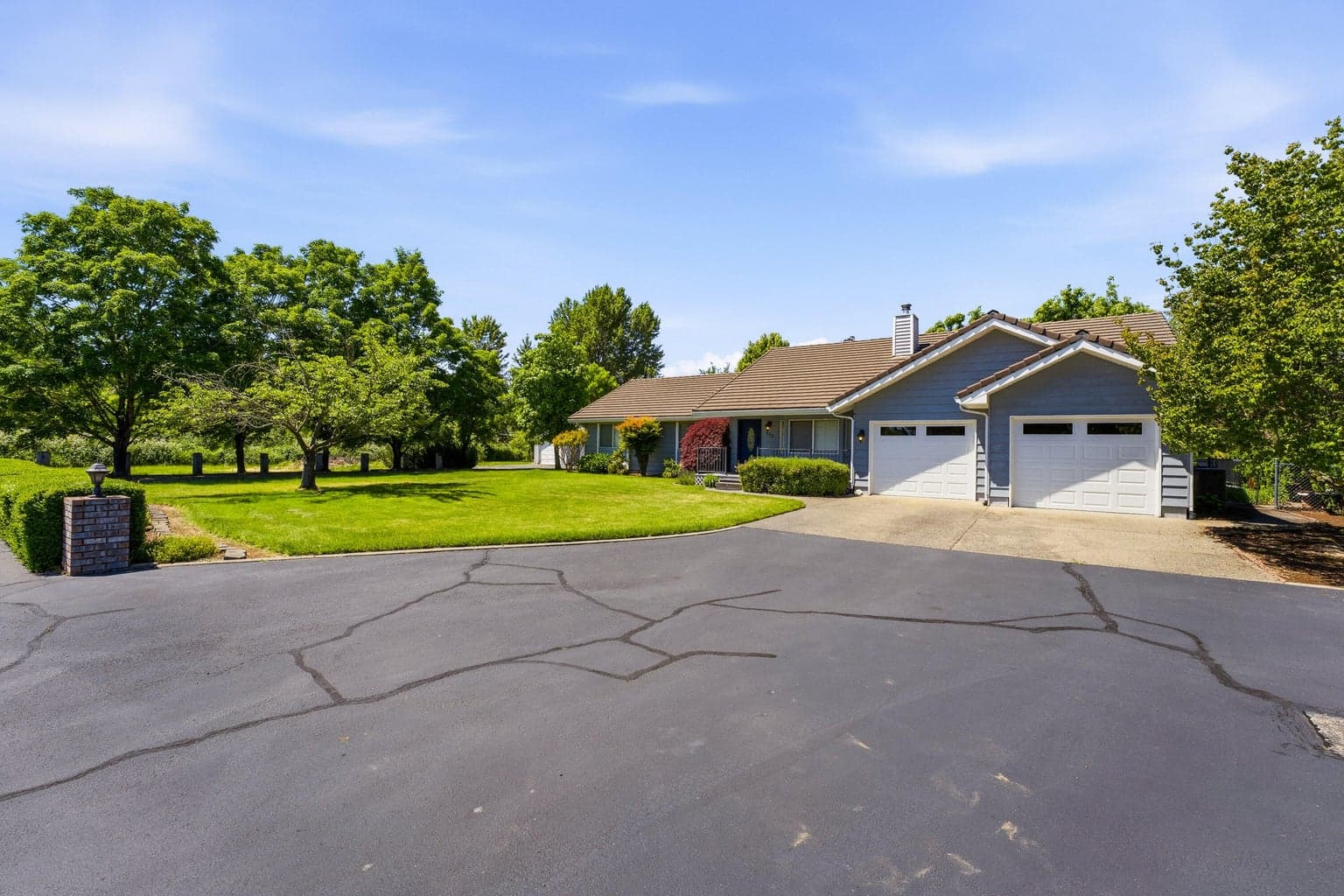 Spacious comfortable country living. Large home, beautiful yards and extra parking.