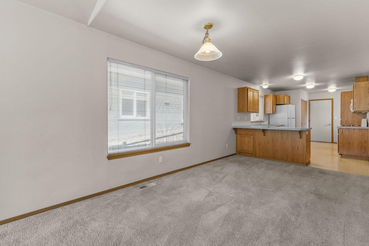 Easy flow between the kitchen, dining & living spaces.