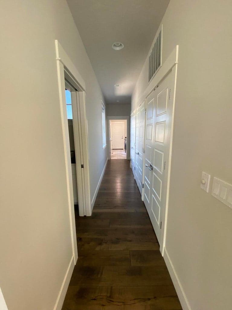Half bath on left. Looking towards hall to guest rooms and garage