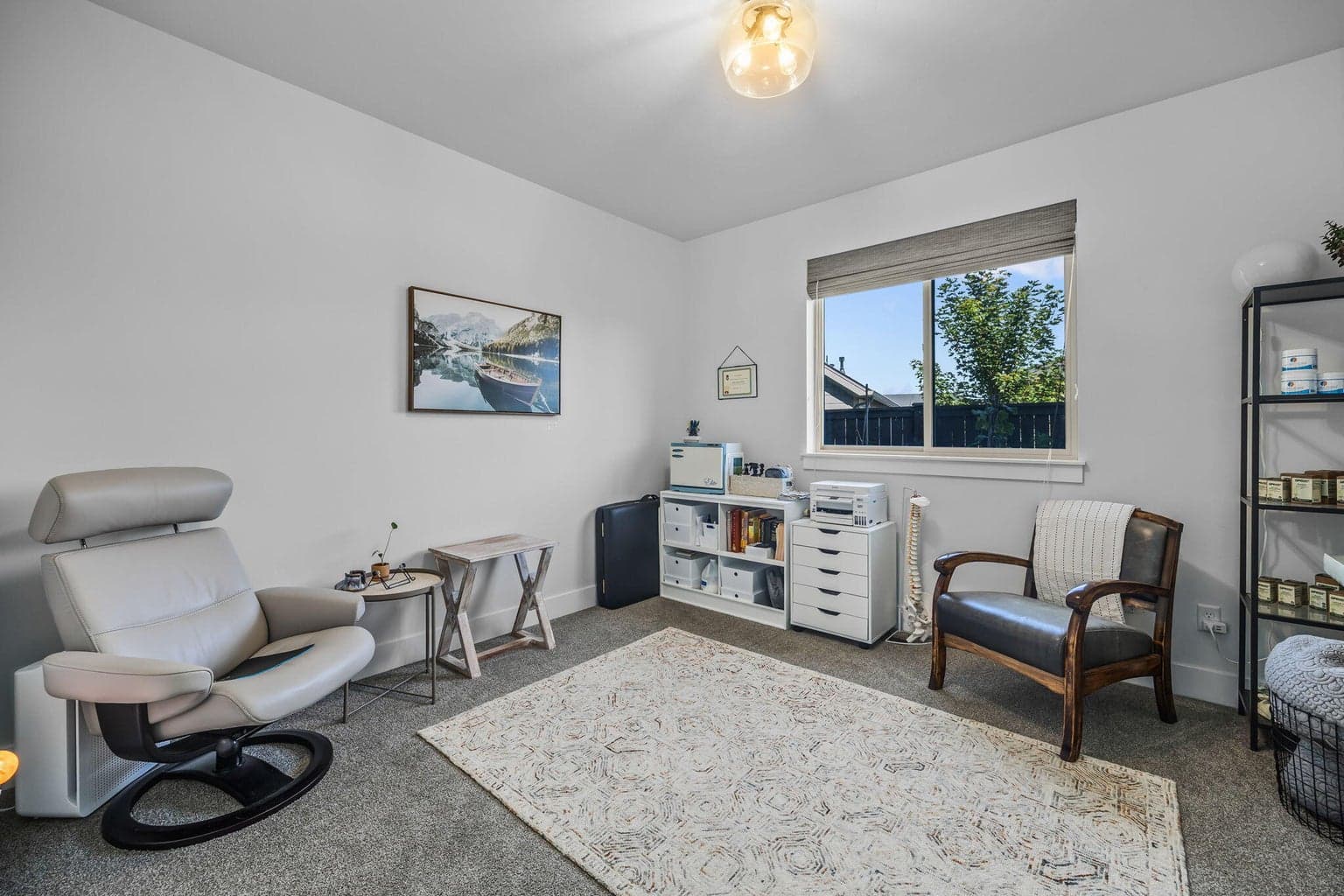Main-level bedroom or office offers flexible living options.