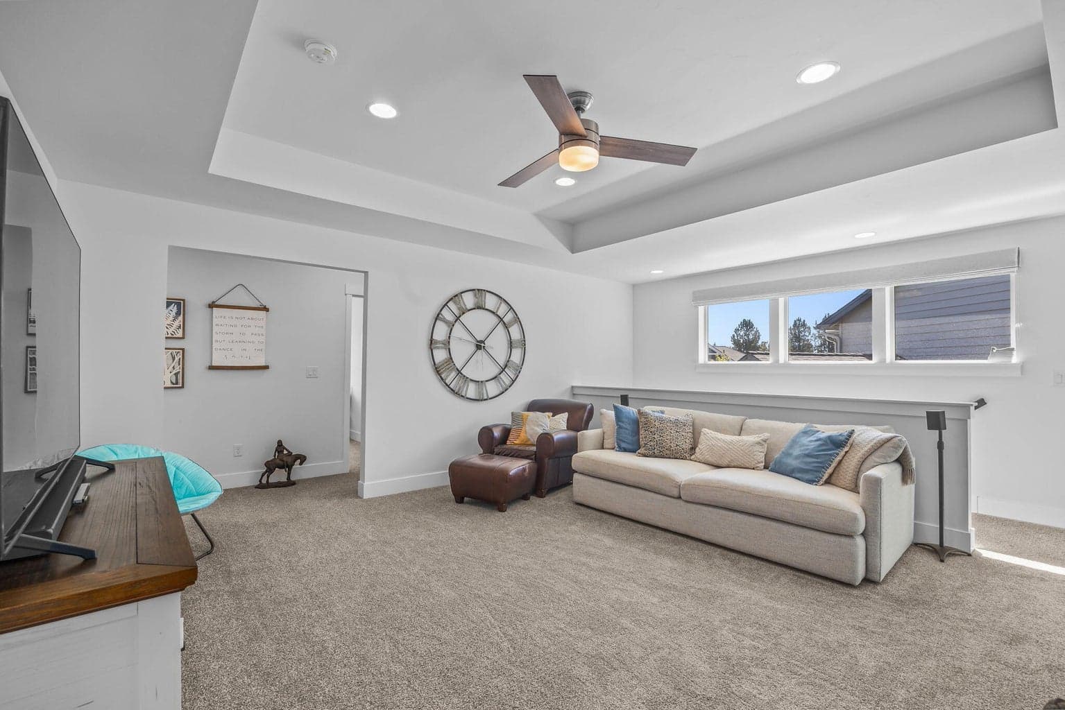 Tray ceilings elevate this versatile second living space.