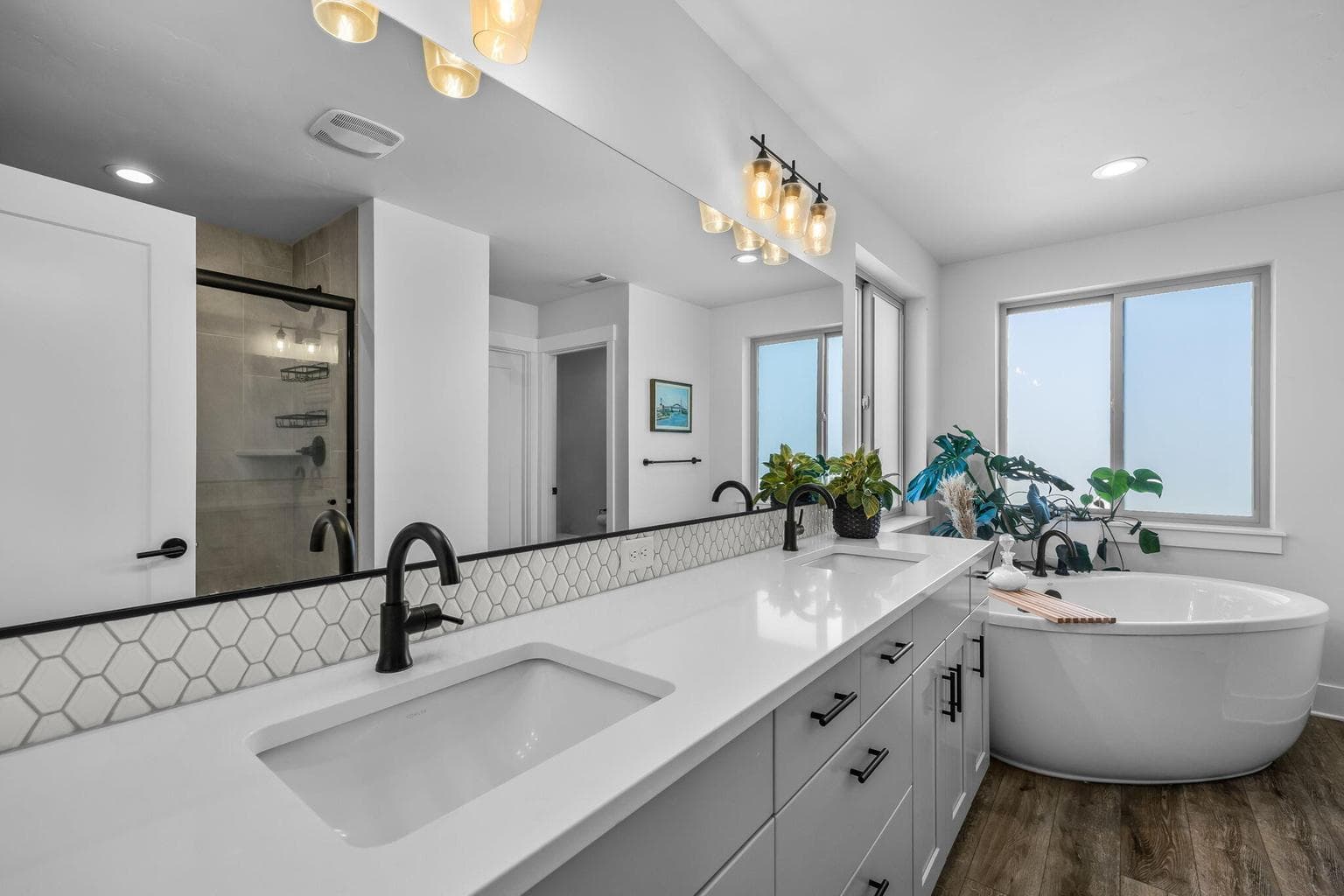Freestanding tub & tiled shower create a luxurious retreat.