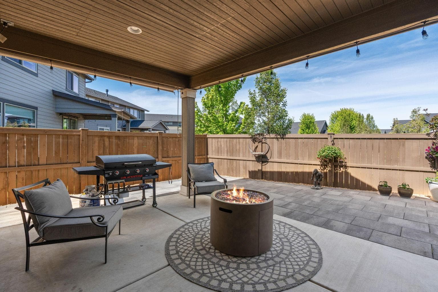 Entertain outdoors in this low-maintenance backyard oasis.