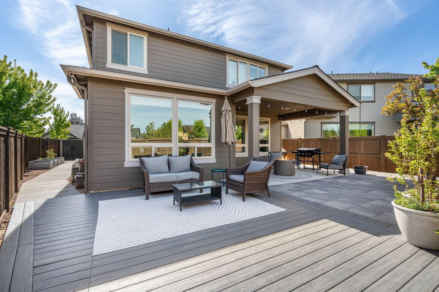 Covered patio & Trex deck create year-round outdoor living.
