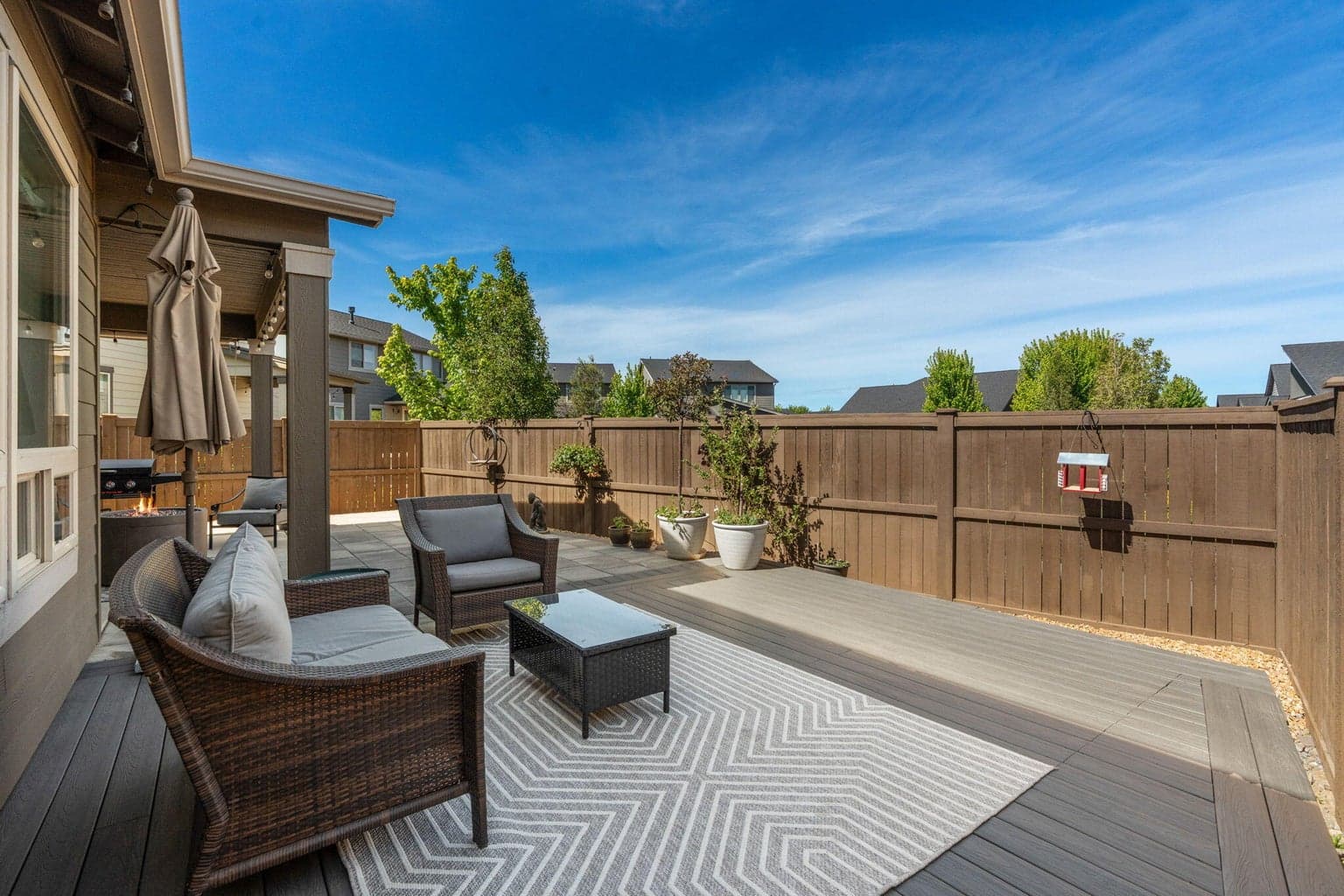 Entertain outdoors in this low-maintenance backyard oasis.