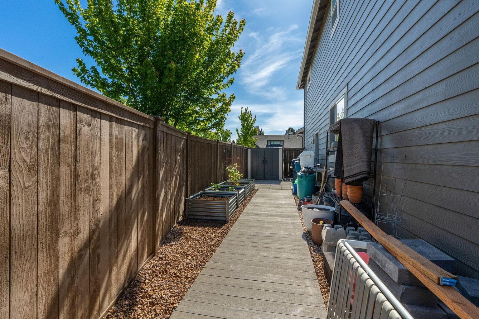 Paved side yard for easy backyard access.
