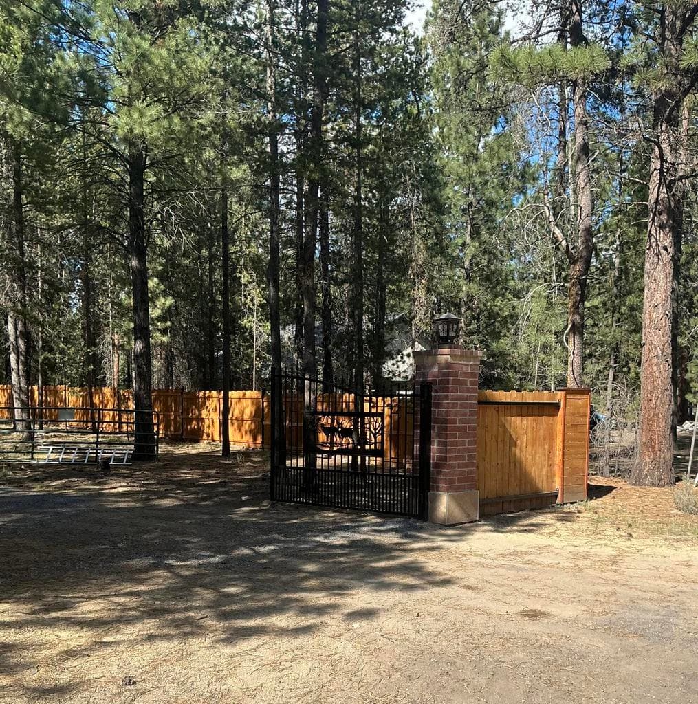Right side driveway entrance metal gate
