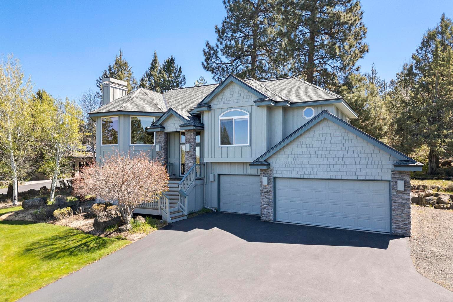 Oversized three car garage with room for RV or trailer parking on the side of the driveway!