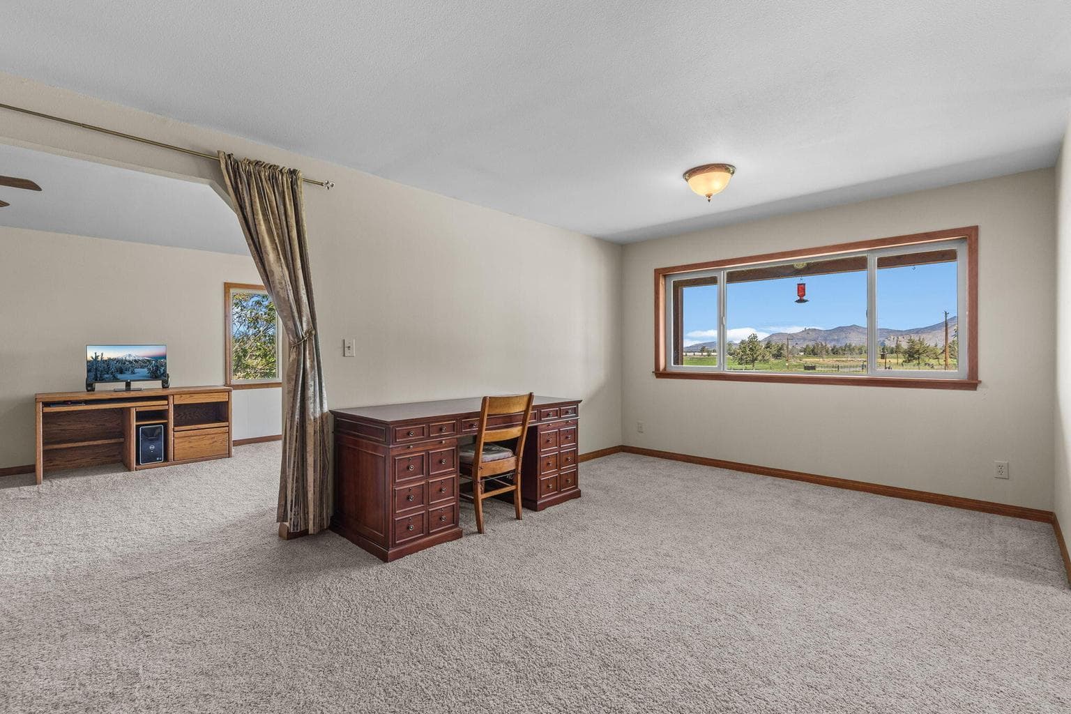 Open flow between living spaces creates effortless functionality.