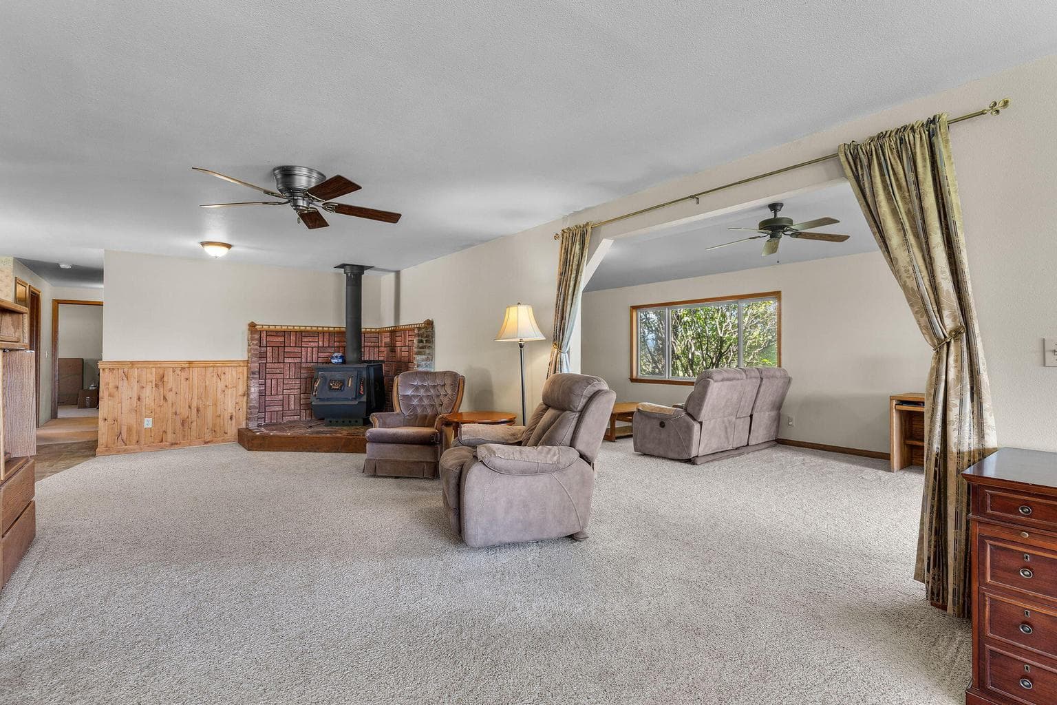 Sunlit great room designed for gathering and relaxing.