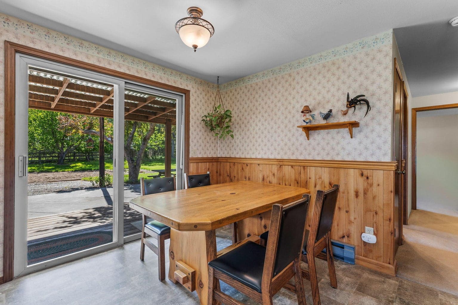 Sunny dining area opens directly to outdoor living spaces.