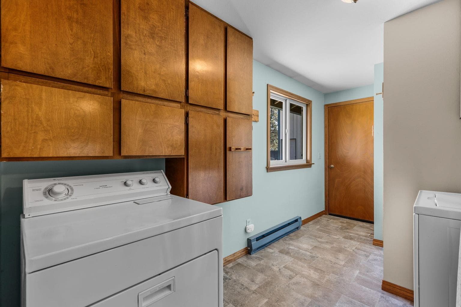 Large mud room w/built-ins keeps everything organized.