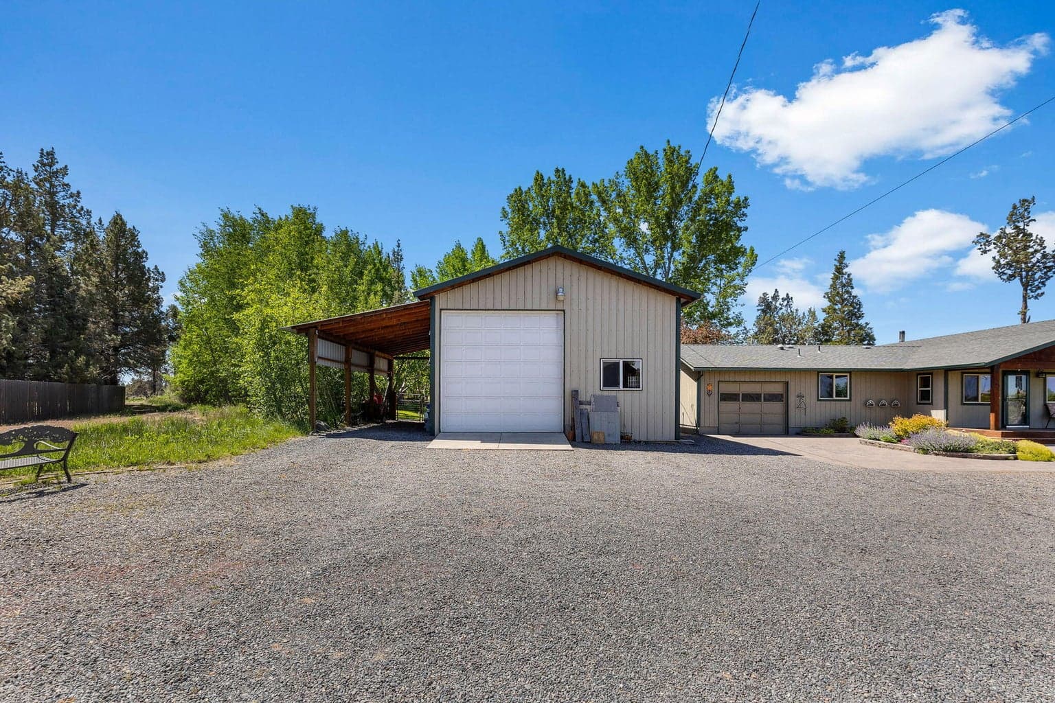Detached shop w/concrete floors & versatile storage space.