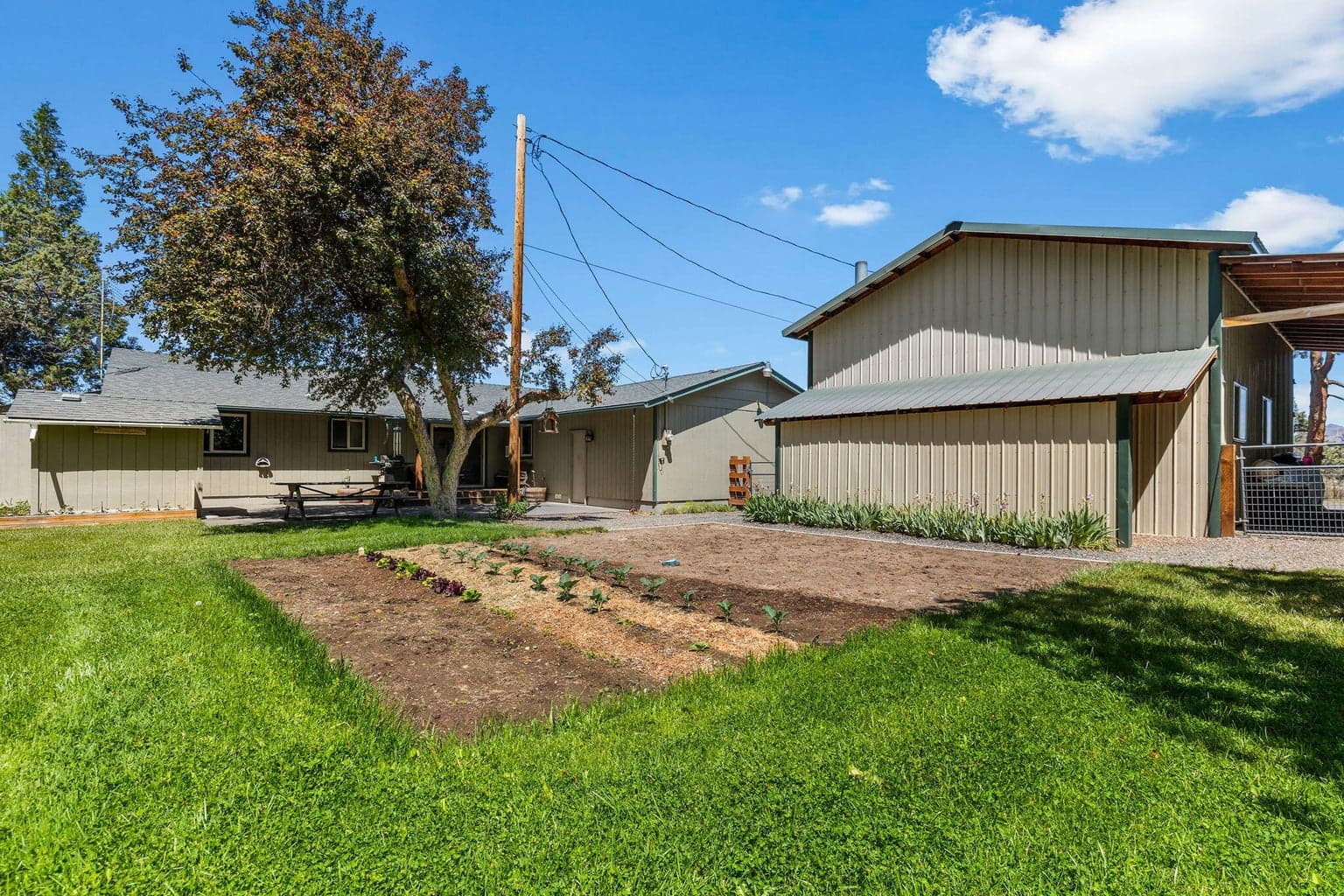 Dedicated gardening spaces complement the hobby farm lifestyle.