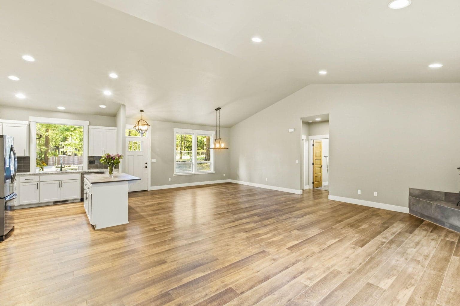 Large windows, great room, durable flooring, move-in-ready home.