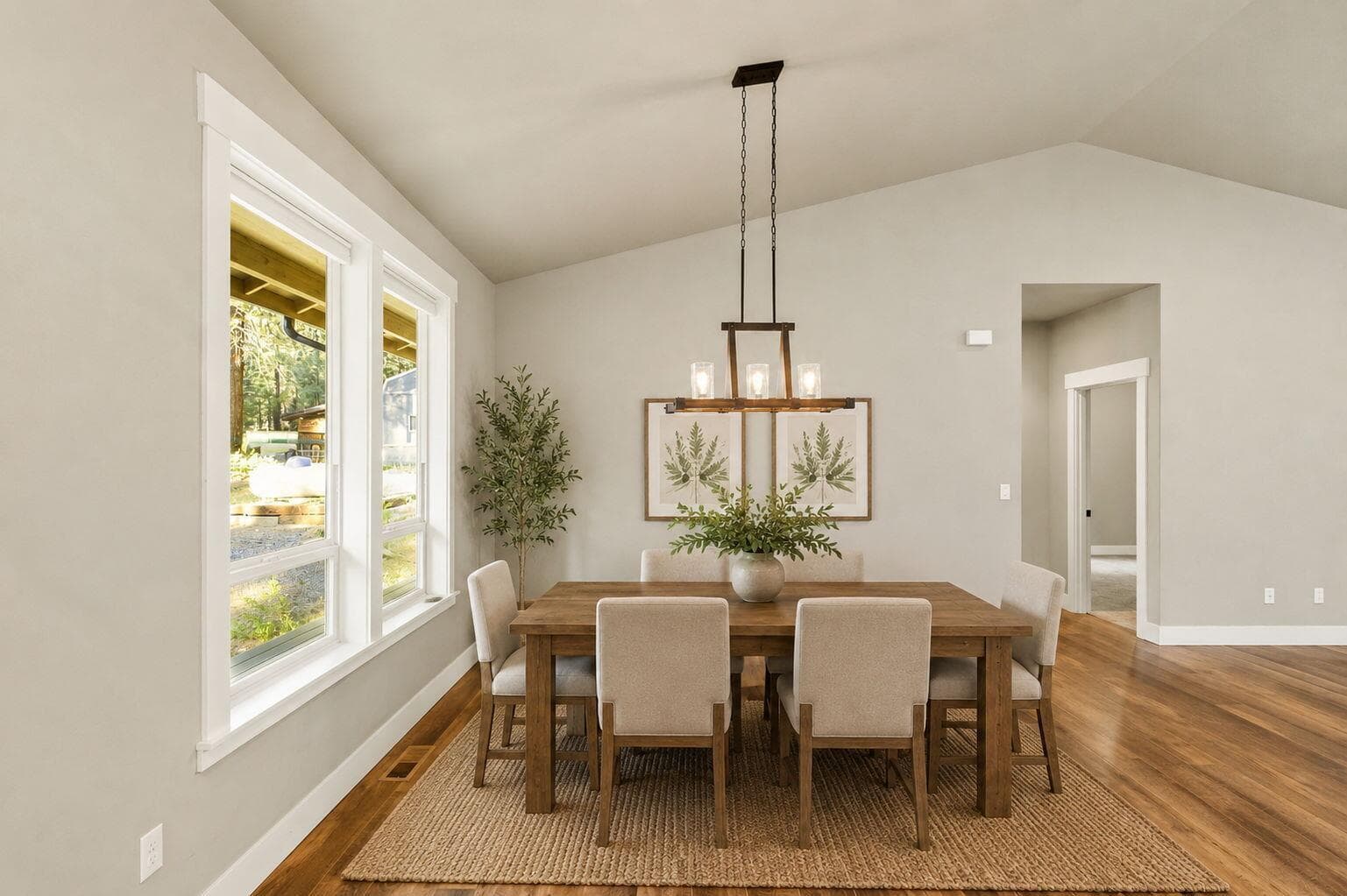 Virtually staged dining space showing scale and layout.