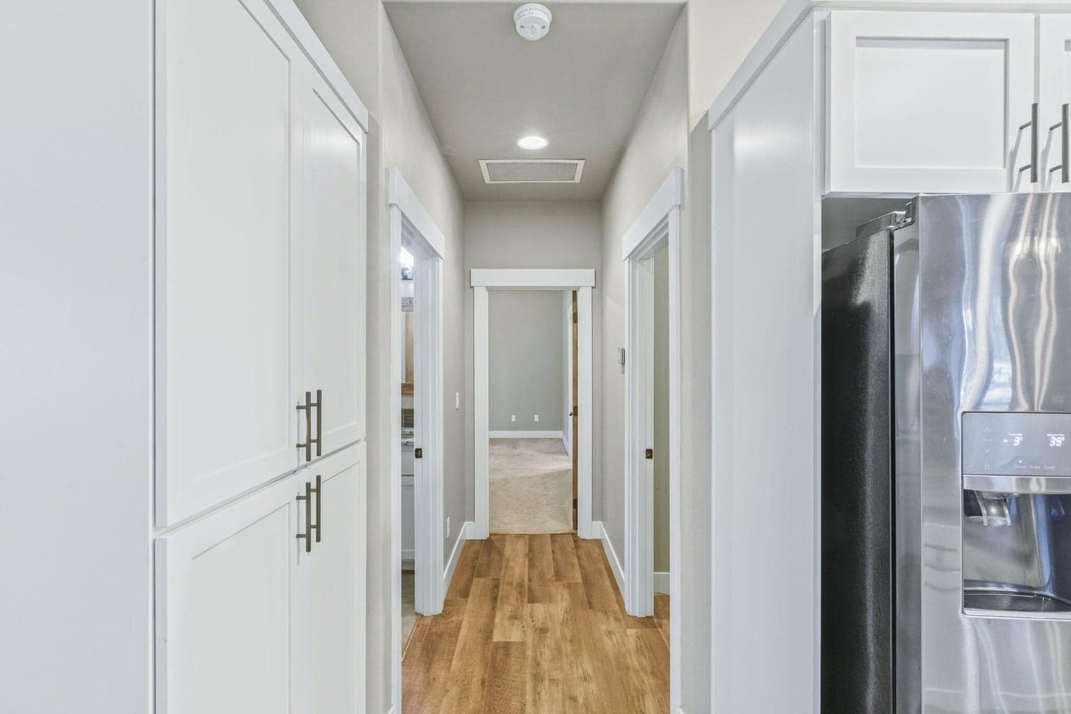 Hallway with built-in storage and access to bedrooms.