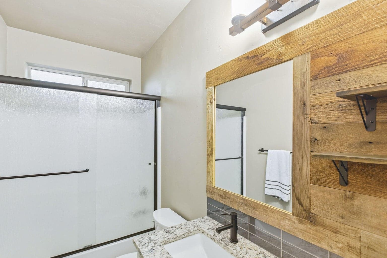 Custom wood mirror and upgraded finishes
