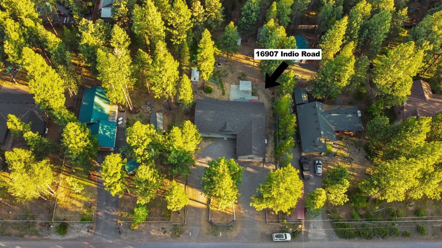 Bird's-eye view highlighting the fenced .51-acre lot,