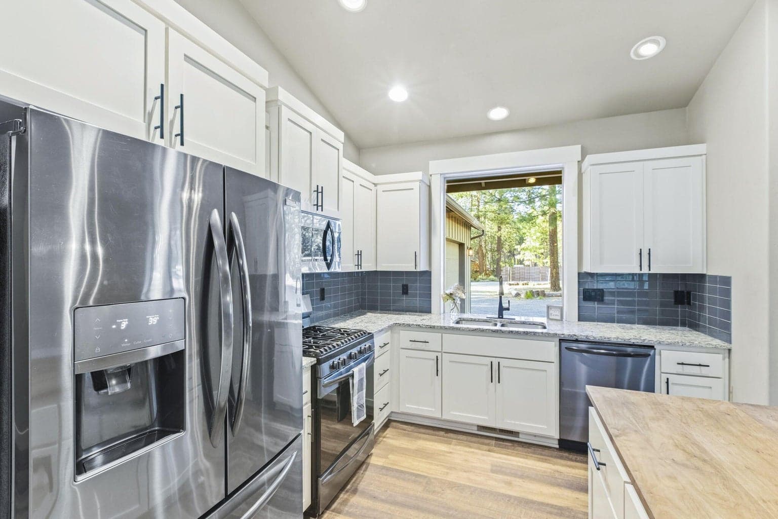 Kitchen with generous cabinetry and natural light.