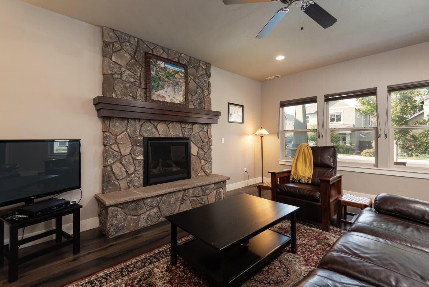 The gas fireplace anchors the great room