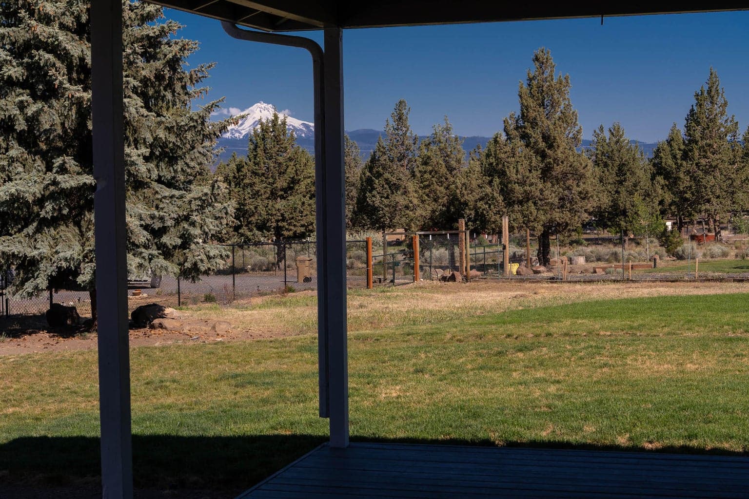 Enjoy a serene view from the covered wrap-around porch.
