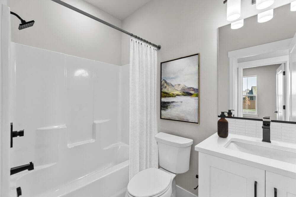 Hall bath, photos are virtually staged.