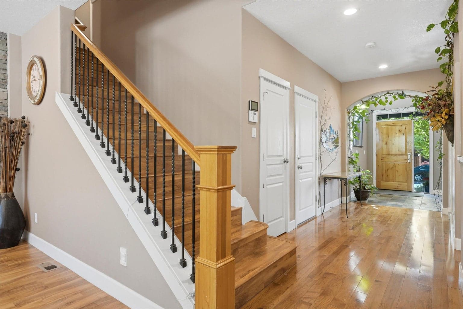 Front entry with coat closet, guest bath, and garage entrance