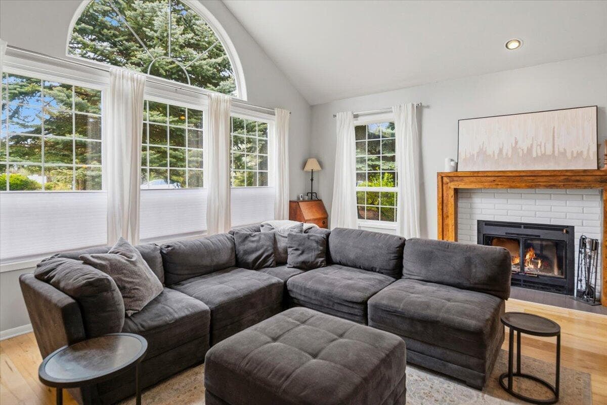 Sunlight pours through expansive windows, creating warm and inviting gathering spaces.