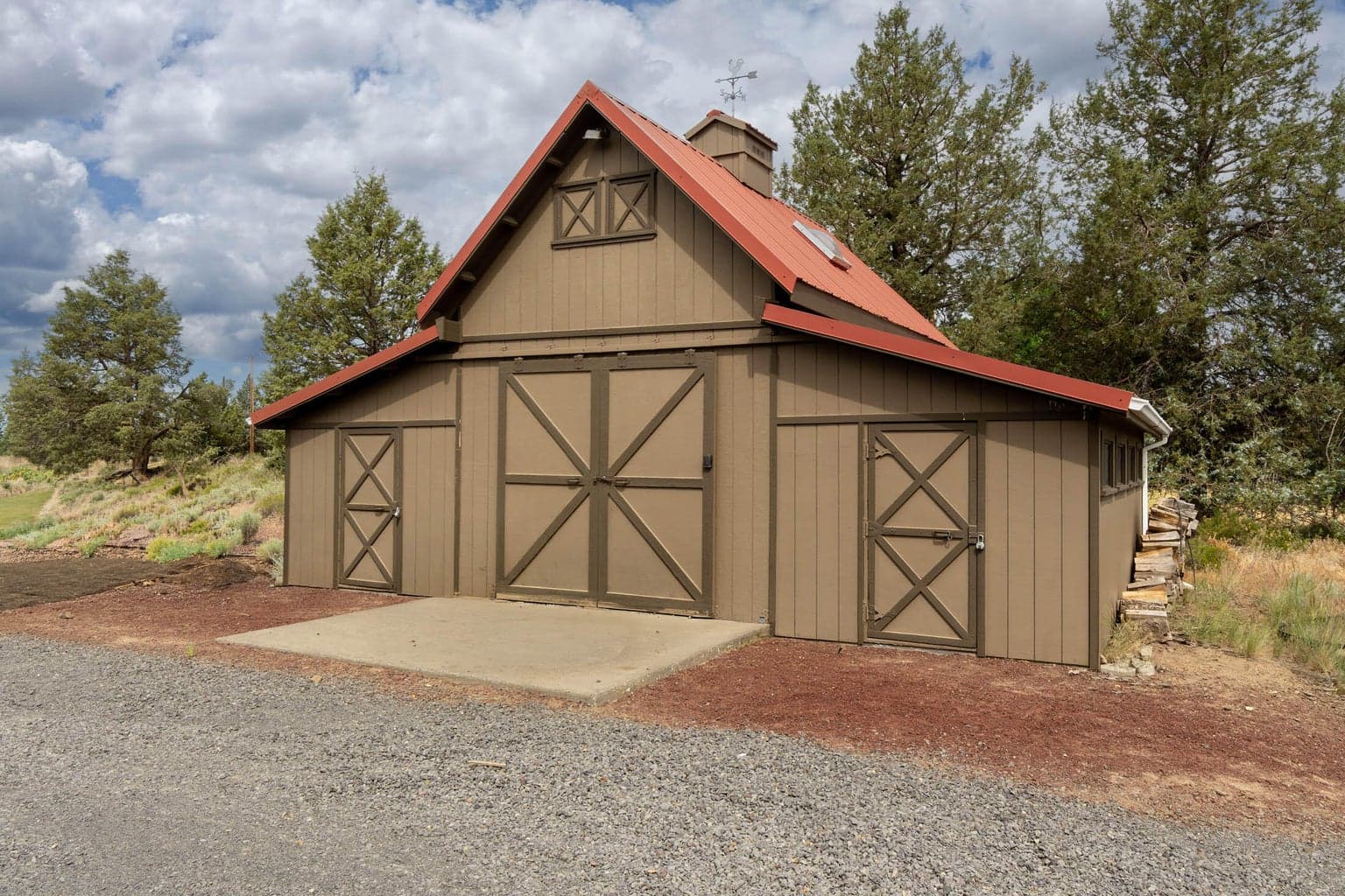 Barn is 240 SF, with loft, concrete flrs. wings are 180 SF each, with gravel flrs